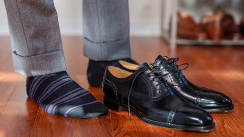black and purple striped dress socks with light grey suit