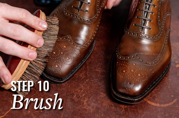 man brushing shoes to a shine with horsehair brush