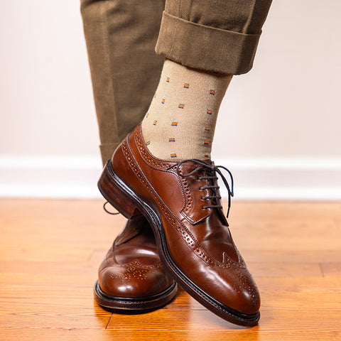 patterned khaki dress socks with olive trousers and wingtips