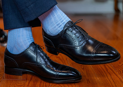 light blue dress socks with dark blue trousers and black oxfords