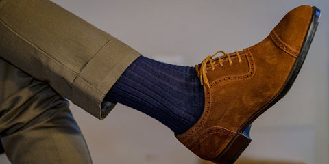 navy socks with a tan suit and brown suede dress shoes