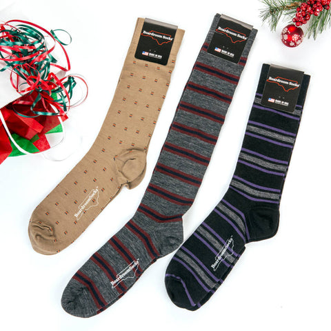 three new dress sock styles from Boardroom Socks arranged with holiday decor