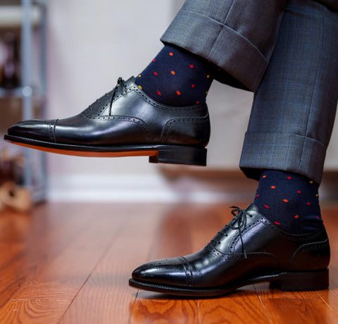 patterned navy dress socks with a grey patterned suit and black oxfords