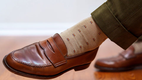 tan socks with a green suit and brown penny loafers