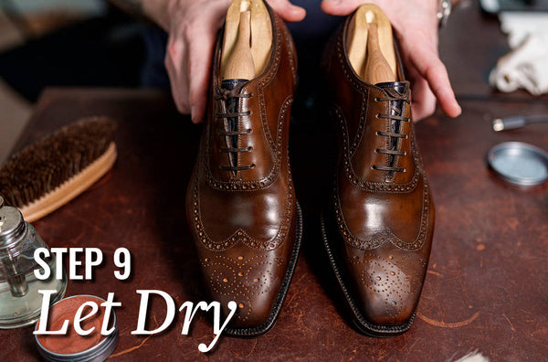 man letting wax polish dry on brown oxford dress shoes