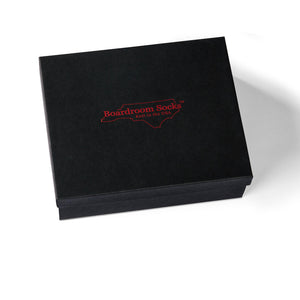 black gift box decorated with red Boardroom Socks logo