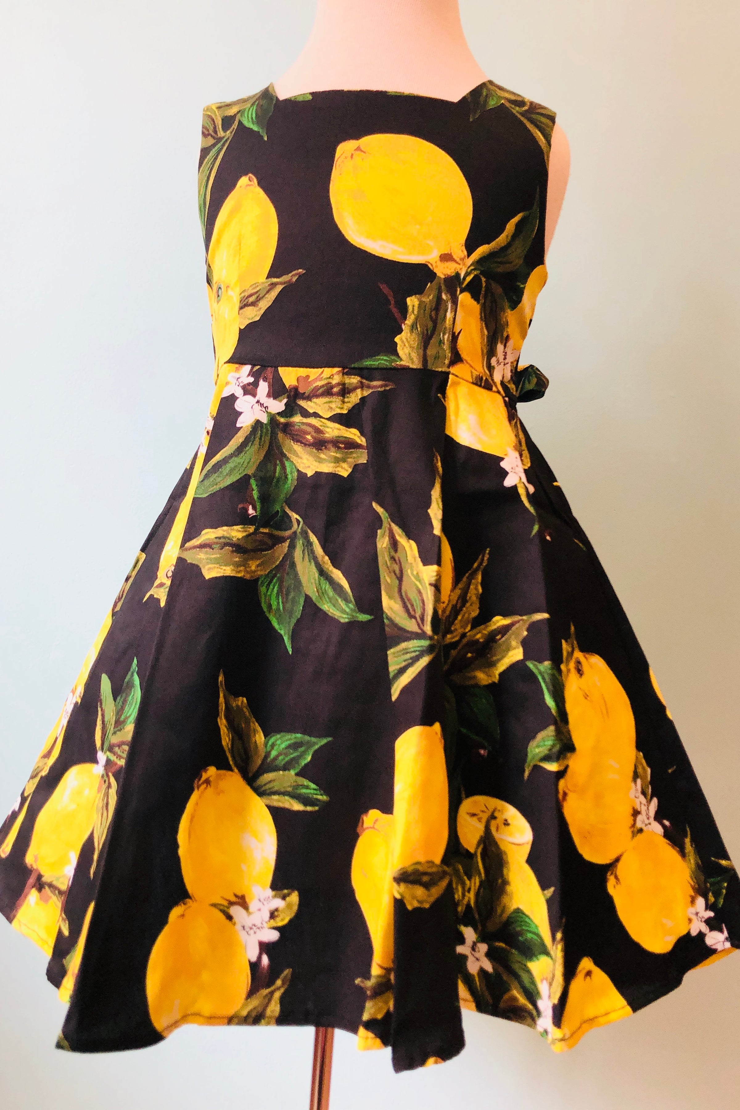 black dress with yellow roses