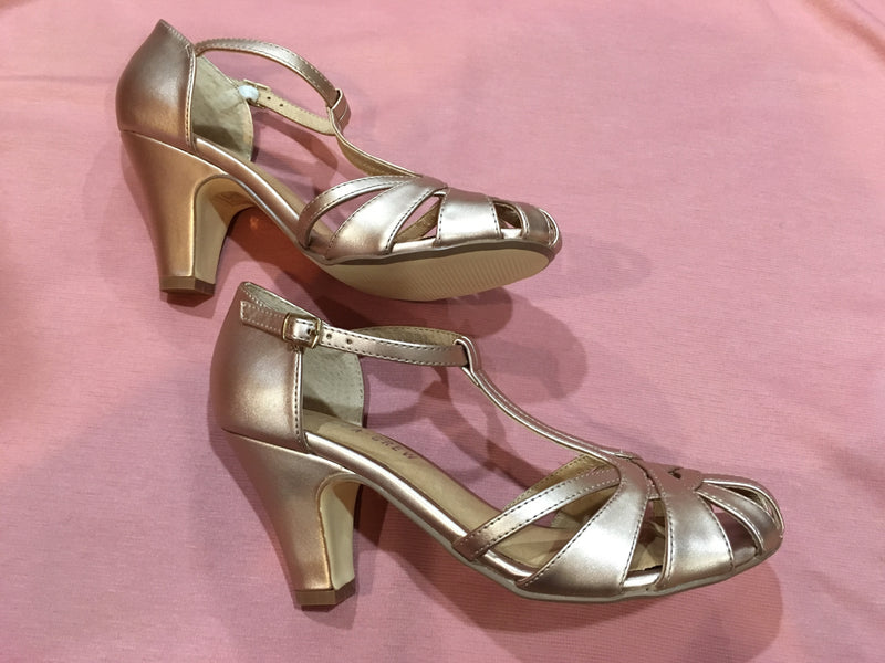 gold t strap pumps