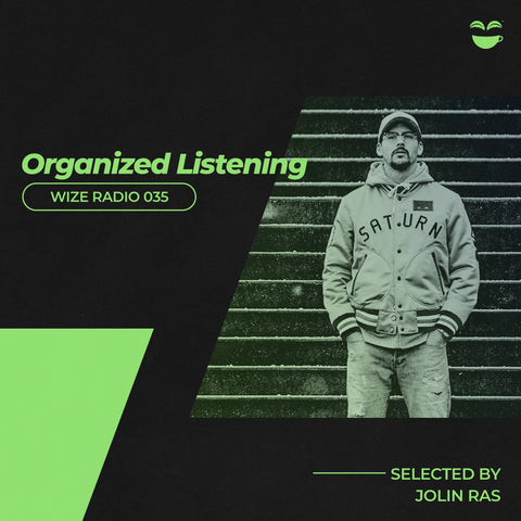 The Spotify cover for Organized Listening, featuring a man standing in front of stone steps with green accented text and design around him.