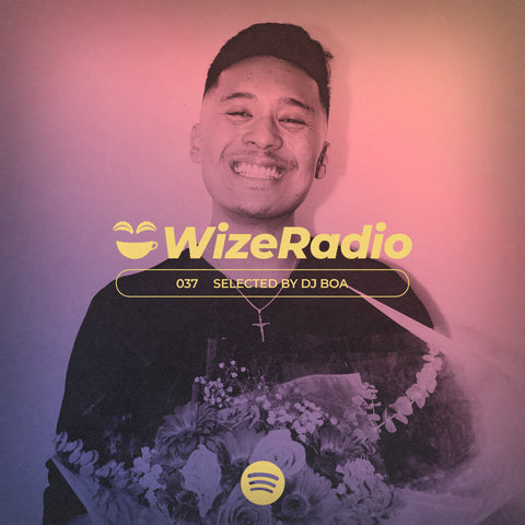 A picture of Steven Gamboa smiling with a pink filter over top and yellow writing saying "WizeRadio" across his neck and chest.