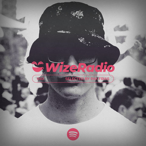 A black and white image of Pax Frias wearing a bucket hat and white t-shirt, with WizeRadio text in pink over his face.