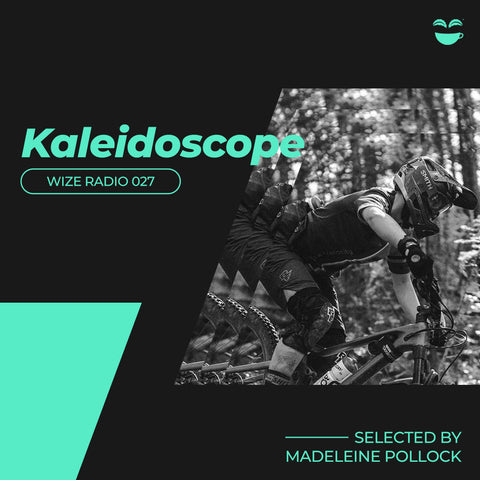 An image of Madeleine on her bike with her helmet on, in black and white. The word Kaleidoscope is written off to the lefthand side in seafoam-green font.