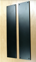 Long matte black push plates made from solid forged steel.