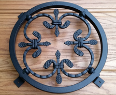 Forged steel security grill with decorative spear rosette