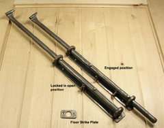 Two cane bolts, one open, the other in the engaged position.