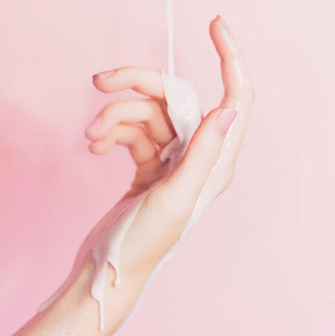 Stock photo of a hand with a pink background
