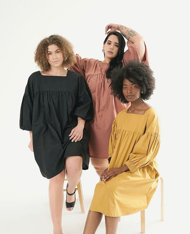 The “CRANE DRESS | THE YOKO CAPSULE” in mustard, sakura, and black. $295 USD.