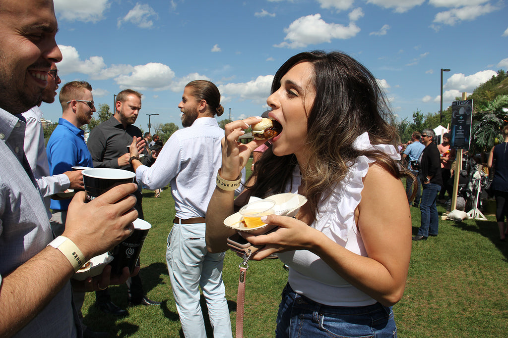 Participant enjoys the entry from local restaurant Cluck & Cleaver at the 2019 Barley & Smoke event