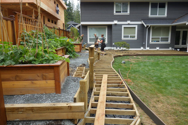 Self-Watering elevated backyard garden. Cedar raised beds, container gardens, and veggie/vegetable gardens featuring GardenWell sub-irrigation to create wicking beds for growing your own food.