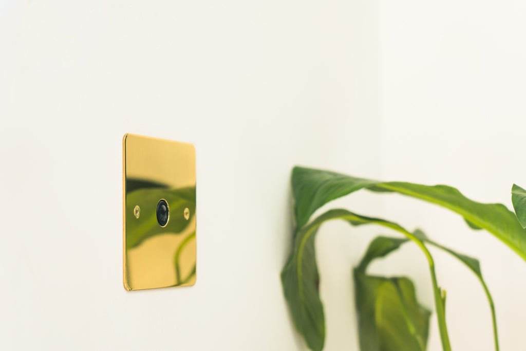 Polished Brass metal plate with motion sensor by Faradite. 