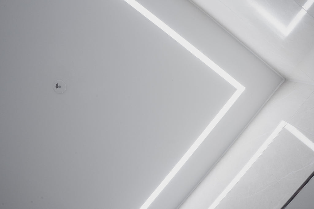 Faradite Motion Sensor 360 - KNX on a white ceiling with LED strip