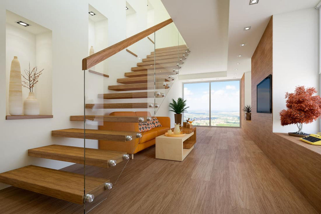 A staircase with glass panel railings.