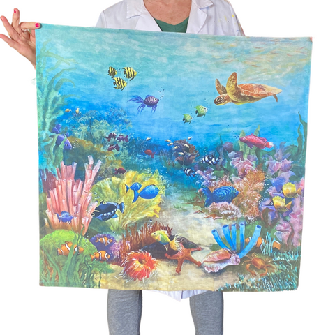 full view of large kitchen towel depicting underwater tropical fish scene.