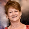 headshot of artist, Patti Clancy, smiling.