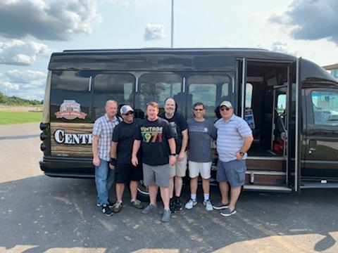 Richard Pappas and Fraternity brothers pose in front a van.