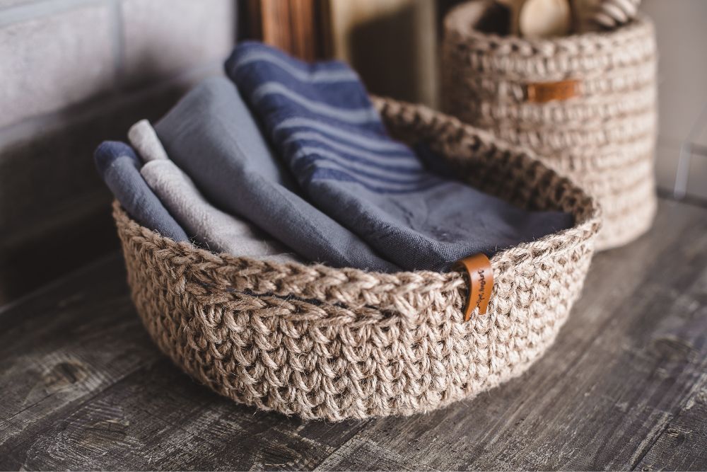 weaved-basket-of-blue-blankets eco-friendly-home-decor-how-to-build-a-eco-friendly-registry-rustic-and-main-blog