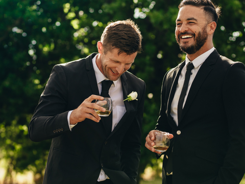 groom-and-his-best-man-enjoy-a-drink