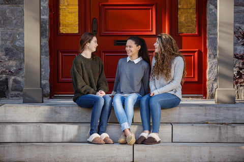 3 young women sitting on steps