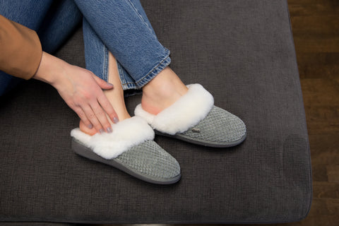 Woman wearing slippers barefoot