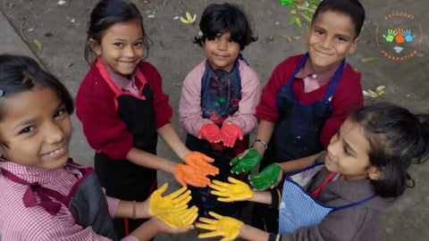 Image with 5 children showing color in their hands