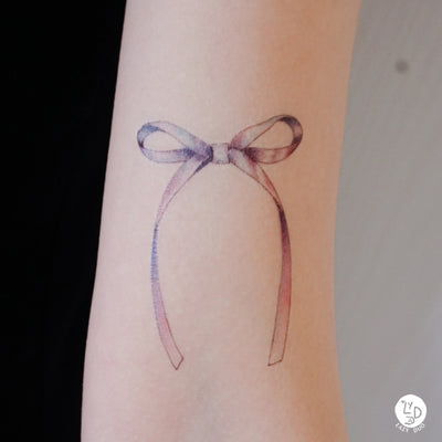 Small bow tattoo- cute wrist tattoo- | Cute tattoos on wrist, Small bow  tattoos, Simple wrist tattoos