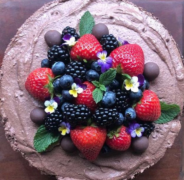 Aubrey's vegan chocolate cake, topped with fresh berries