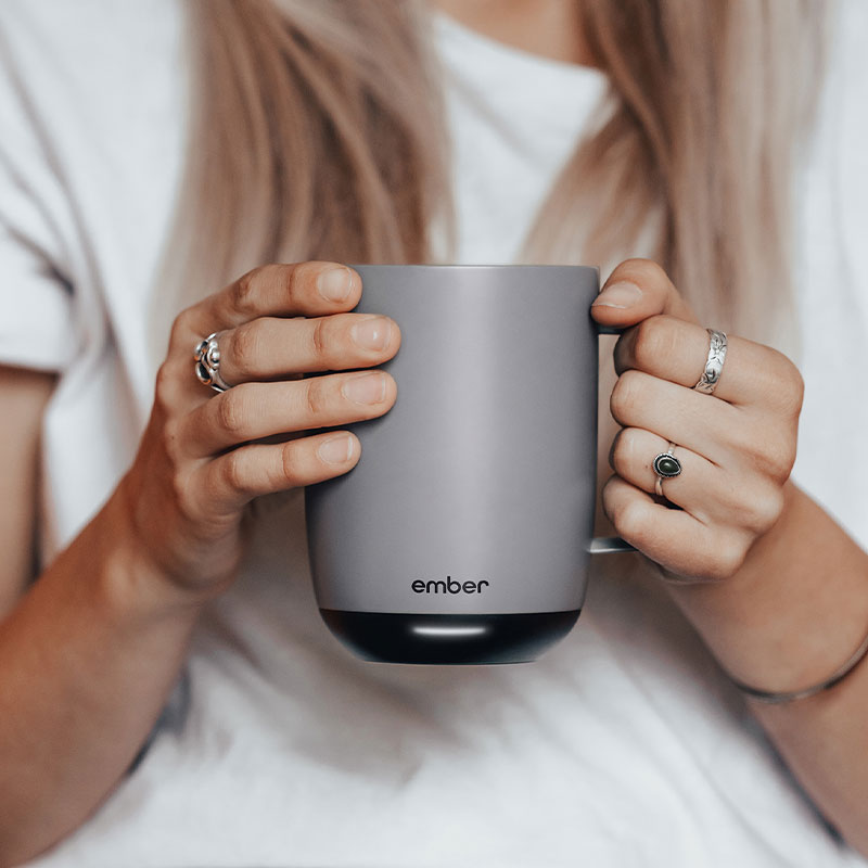 Person holds a Gray Ember Mug 2.