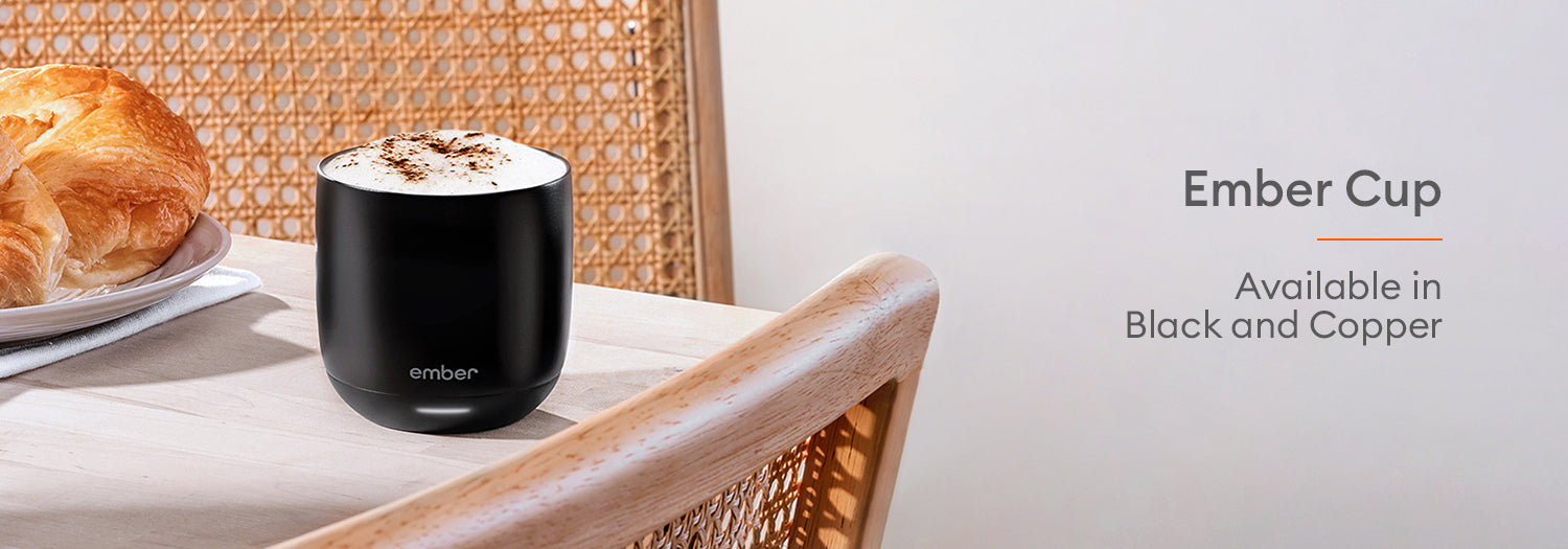 Ember Mug²: Copper Edition on a marble countertop with a cream speckled wall.