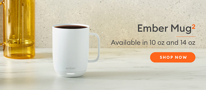 White Ember Mug2 sits on a marble countertop. Ember Mug2 - Available in 10 oz and 14 oz. Shop Now.