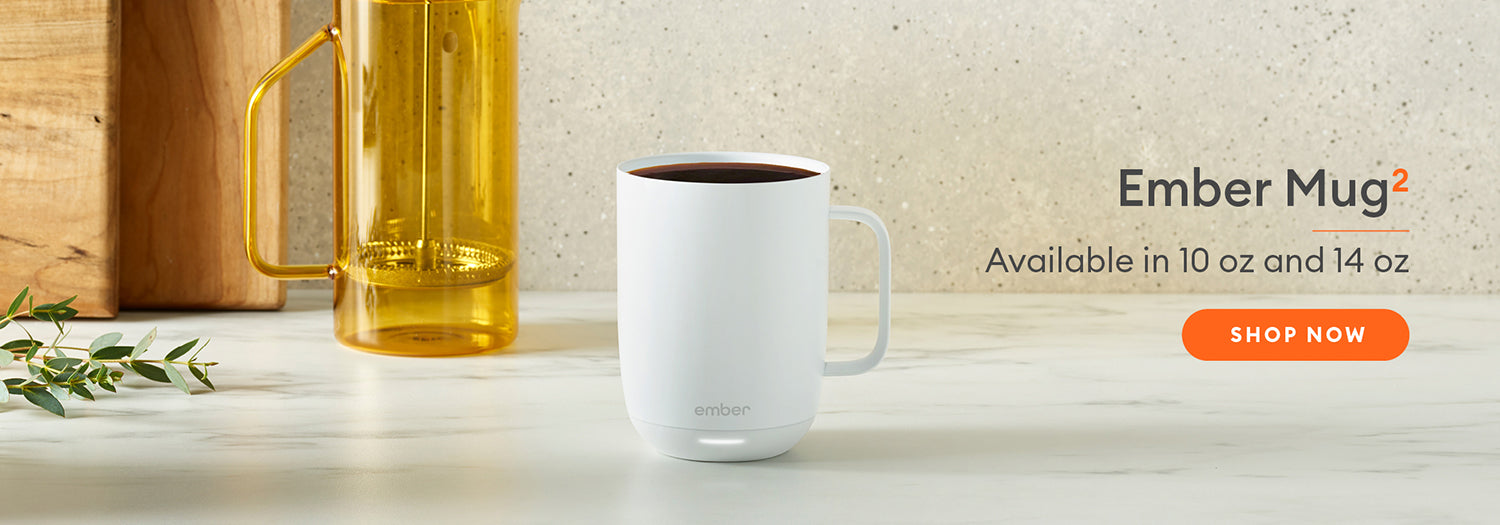 White Ember Mug2 sits on a marble countertop. Ember Mug2 - Available in 10 oz and 14 oz. Shop Now.