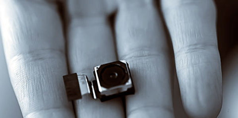 image of spy camera in the palm of hand