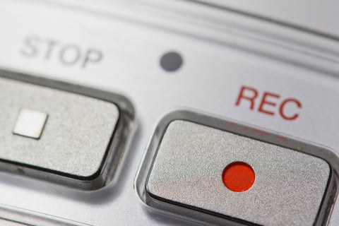 close up of electronic device's stop and record buttons