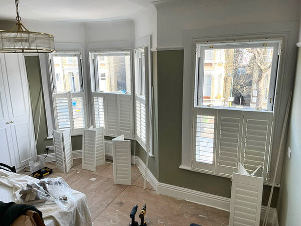 room with during the installation of shutters on the windows