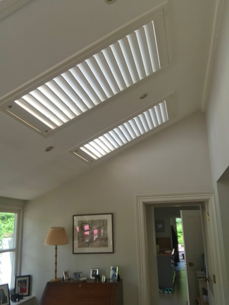 detail of a room with sky lights and shutters installed on them