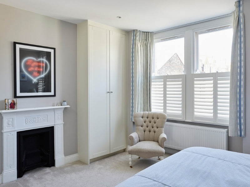 cafe style shutters in a bedroom
