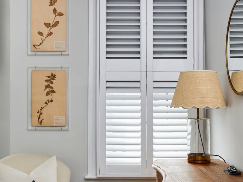 detail of a window with shutters and honeycomb blinds, a combination which ensure the best energy savings