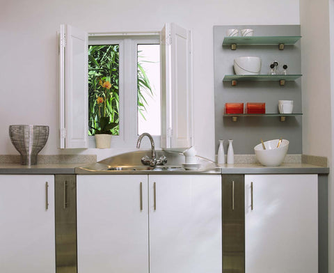 white kitchen with white solid panel shutters on the window