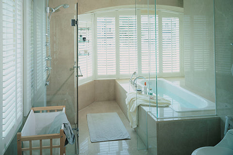 bathroom window treatment ideas bathtub in a bay window with plantation shutters