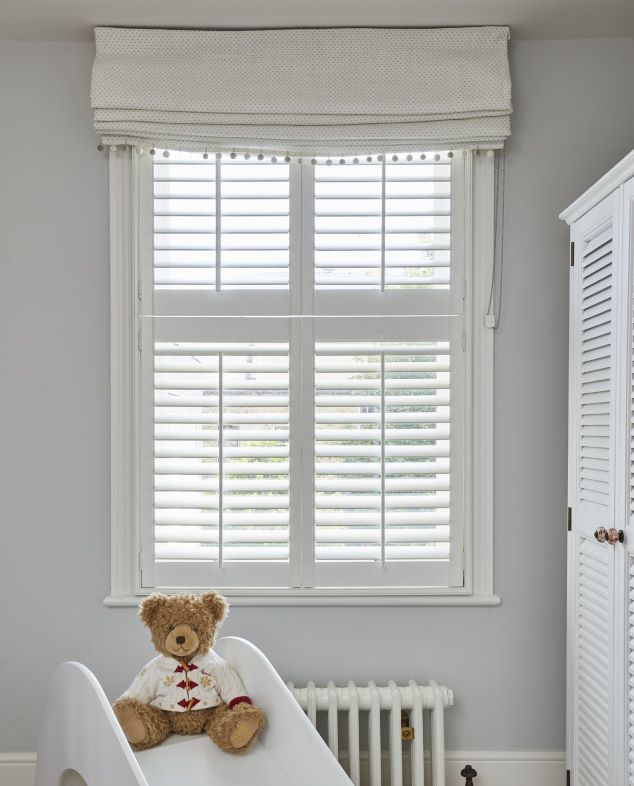 nursery with white tier on tier shutters