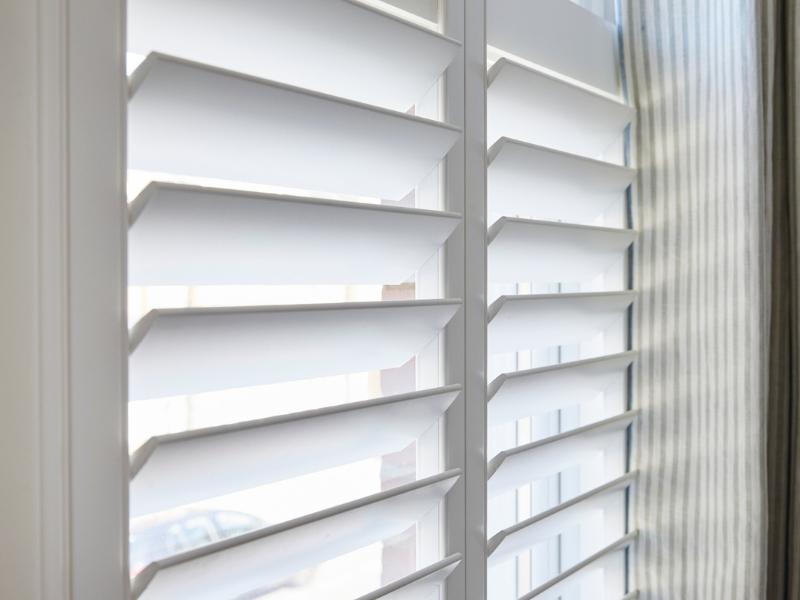 detail of plantation shutters to show how the louvres can trap the heat behind the window